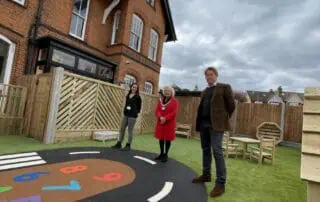 Colorful outdoor play area featuring a designated road and number markings at Monkey Puzzle Day Nurseries. Perfect environment for early childhood education and fun learning activities.