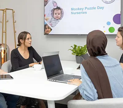 Monkey Puzzle staff members in a meeting about Imbiba Investment