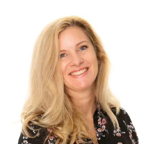 Joy Wood – Early Years Quality Manager Bright smiling woman with blonde hair, representing the caring staff at Monkey Puzzle Day Nurseries, promoting a warm and nurturing environment for children.