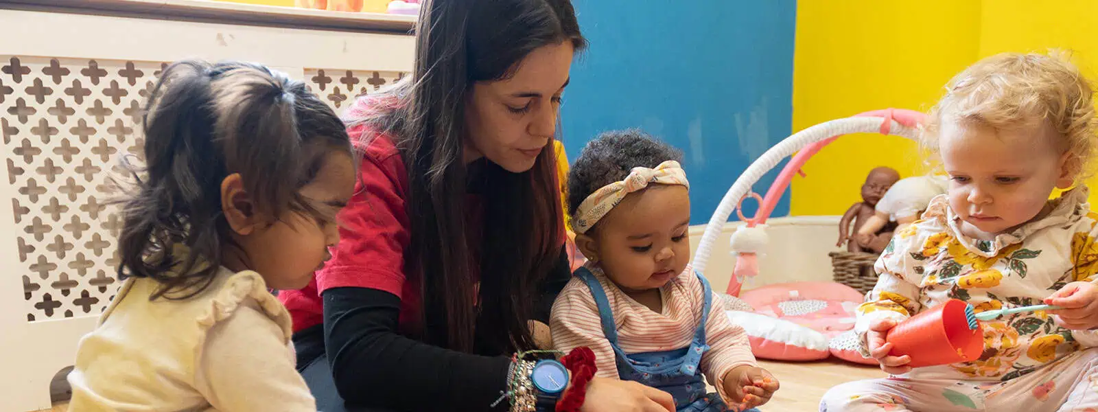 Children engaged in early learning activities at Monkey Puzzle Day Nurseries, promoting safe, nurturing environments for age-specific childcare and child development.