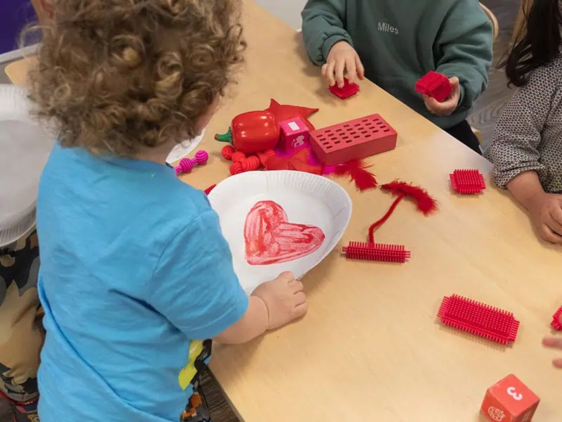 Bright-eyed children engaging in hands-on art and educational activities at Monkey Puzzle Day Nurseries, fostering creativity, learning, and social development in a nurturing environment.