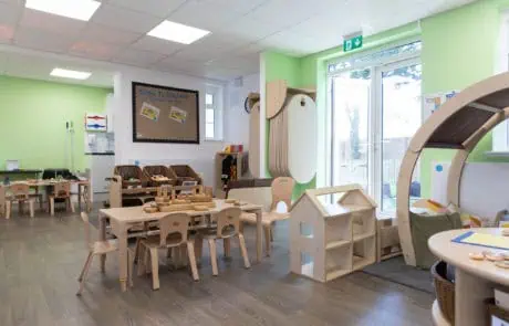 Beautiful rooms at Monkey Puzzle Sutton Bright and welcoming indoor play area at Monkey Puzzle Day Nurseries with wooden furniture, educational toys, and colorful decor designed for early childhood development.