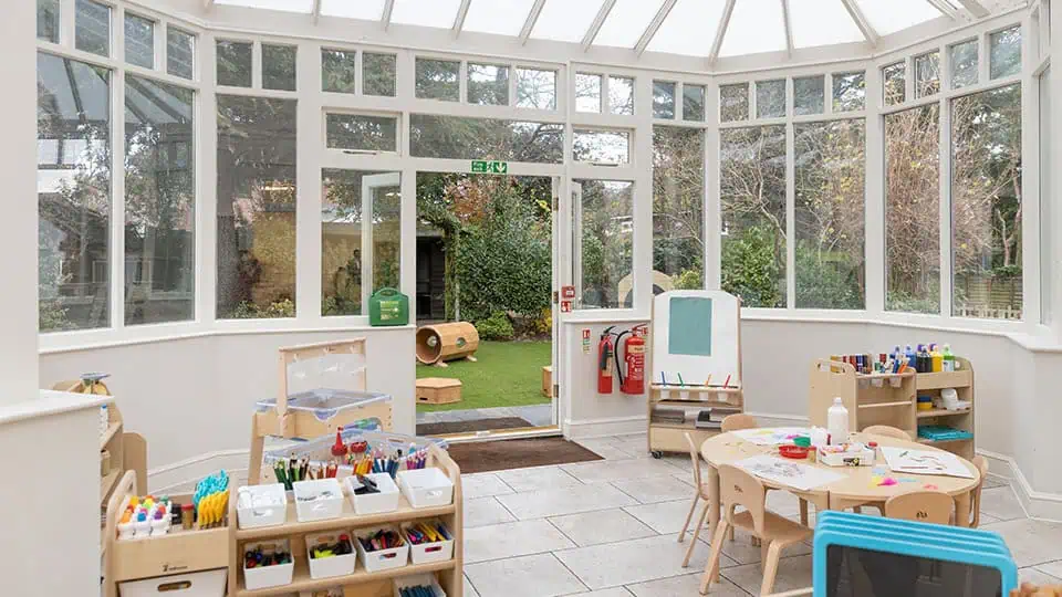 Bright and welcoming indoor playroom at Monkey Puzzle Day Nurseries, designed to foster early childhood development with engaging educational toys and activities.