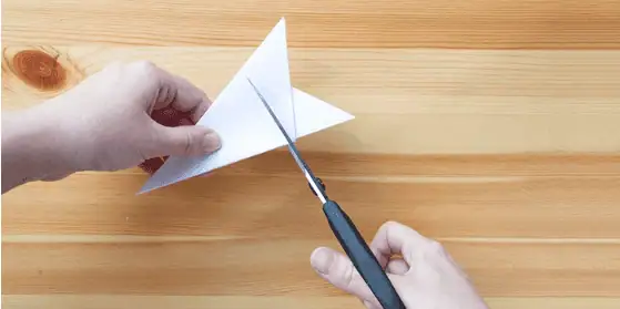 Paper snow flakes – Step 6 Colorful paper airplane craft activity at Monkey Puzzle Day Nurseries for early childhood development and creative learning.