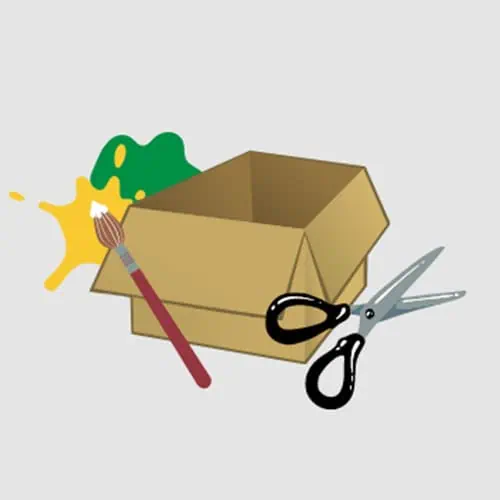 Gingerbread Cardboard Decorations – Step 1 Colorful craft box with scissors, paintbrush, and paint splashes, representing creative arts for young children at Monkey Puzzle Day Nurseries.