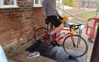 Andy is ready to go for Children in Need Stationary indoor cycling bike at Monkey Puzzle Day Nurseries for outdoor activity and child-friendly exercise.