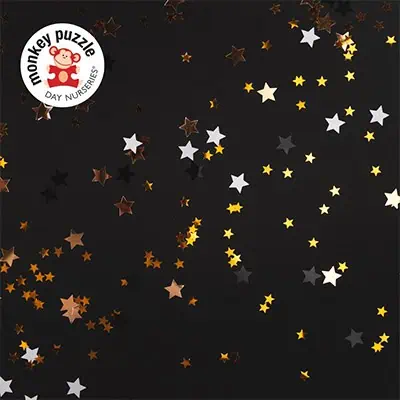 Colorful star-shaped confetti on a dark background, ideal for children's nurseries, preschool activities, and celebratory decorations.