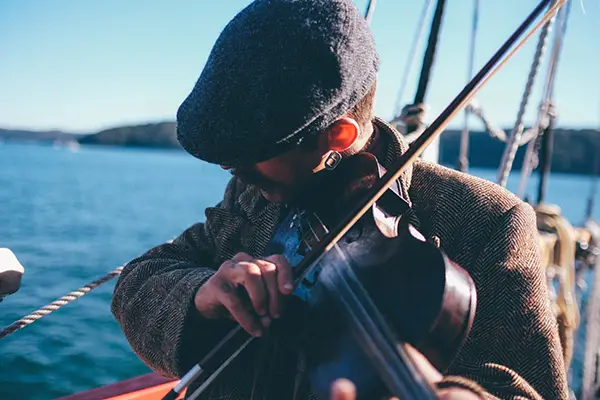 Irish man playing a fiddle Irish man playing a fiddle