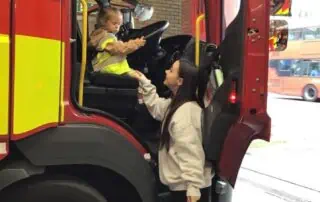 Fire truck children safety gear educational play firefighter costume learning experience.