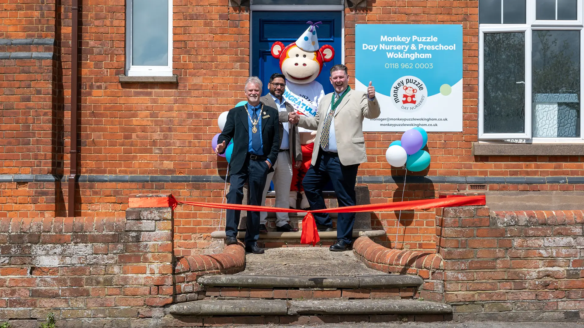 Dilpreet Singh cutting the ribbon of Monkey Puzzle Wokingham with the Mayor of Stevenage, Rob Comer, and local Councillor Adrian Mathers