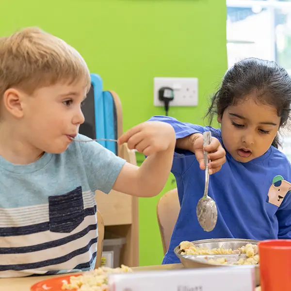 Preschool children enjoying trying food