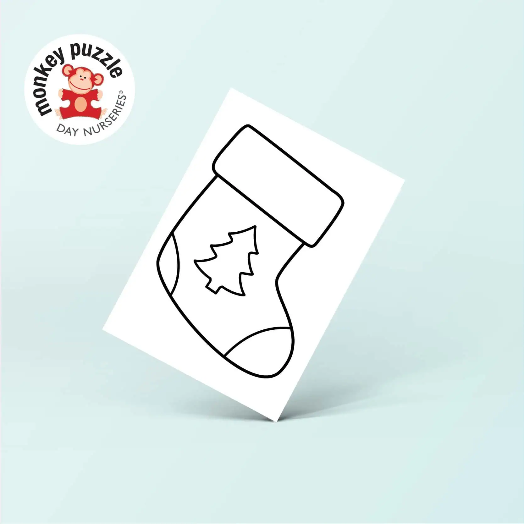 Coloring page of a Christmas stocking with a holiday tree on it, suitable for young children at Monkey Puzzle Day Nurseries.