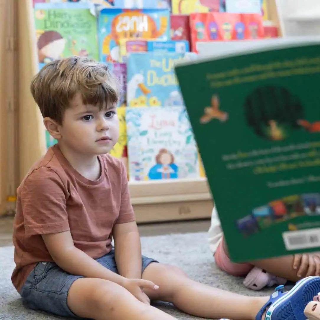 Colorful children's books display at Monkey Puzzle Day Nurseries, promoting early literacy and learning in a vibrant preschool environment.
