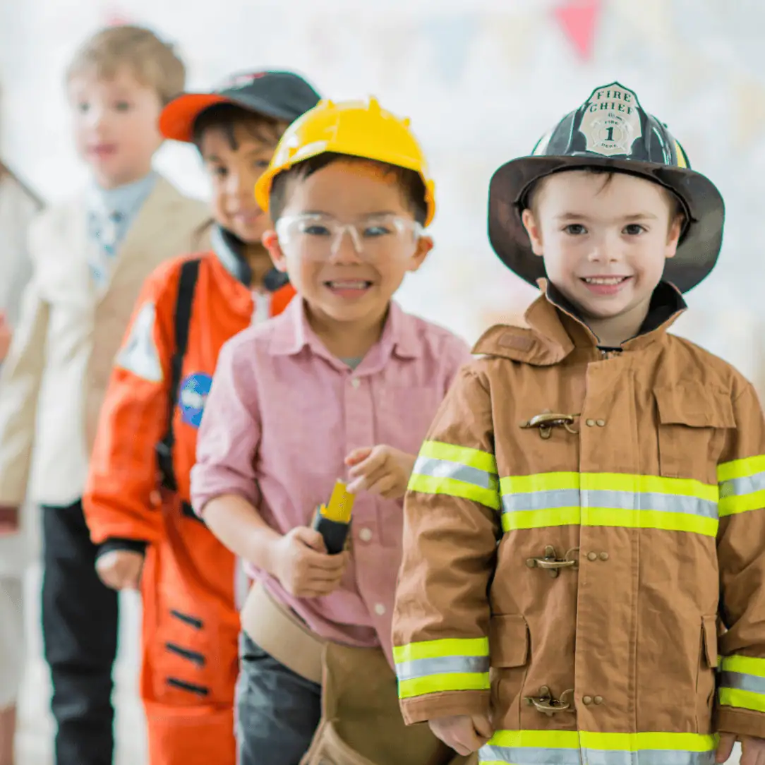 Little Dreamers Big Futures Summer Campaign Cute children dressed as firefighters and rescue workers at Monkey Puzzle Day Nurseries.