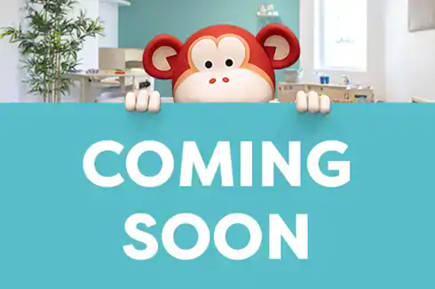Adorable monkey mascot welcoming in vibrant nursery environment, signaling new childcare or preschool opening at Monkey Puzzle Day Nurseries, focusing on early childhood education and childcare services.