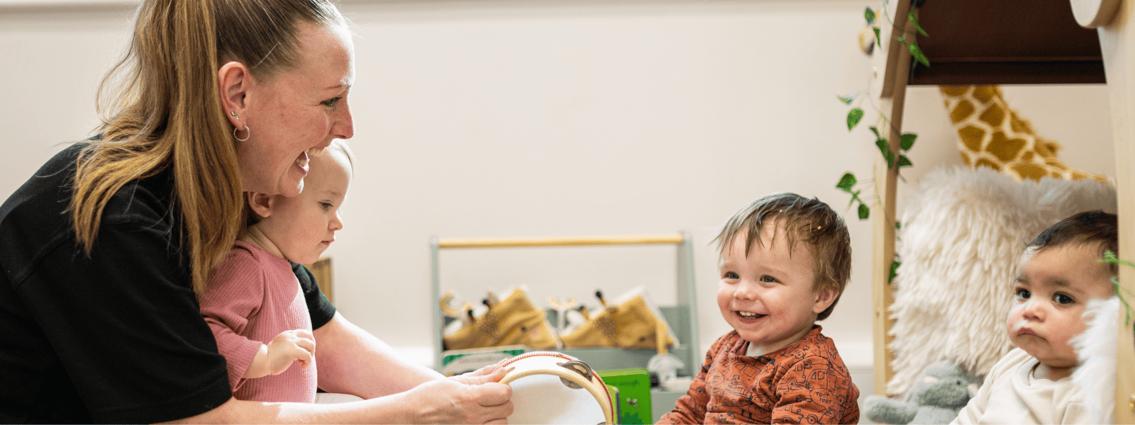 Childcare professionals supporting early childhood development at Monkey Puzzle Day Nurseries, emphasizing the importance of recruitment support for franchise success.