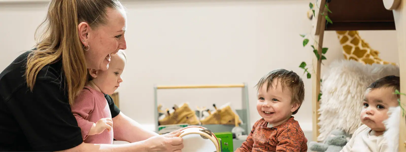 Childcare professionals supporting early childhood development at Monkey Puzzle Day Nurseries, emphasizing the importance of recruitment support for franchise success.